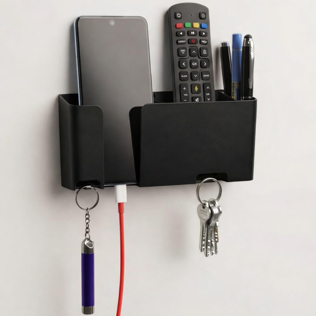 Mobile & Remote Wall Holder | ABS Wall Mount Stand with 3 Compartments for Phone, Remotes & Pens | 2 Key Hooks | No-Drill Mount with Strong Double-Sided Sticker (Black)
