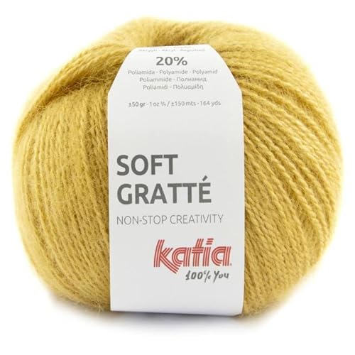 Lanas Katia Soft Gratte. Ovillo de color dorado, mezcla de acrílico y nailon, 1.8E+2 yards