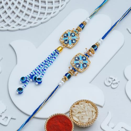Image of eCraftIndia Blue Beautiful Floral Evil Eye Designer Bhaiya Bhabhi Rakhis with Best Bro Ever Fridge Magnet | Set of 2 Rakhi for Brother and Bhabhi | Lumba Rakhi | Roli Chawal Pack