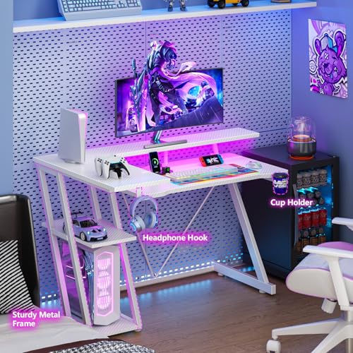 Image of Korfile 40 Inch Gaming Desk with Power Outlet & LED Lights, L Shaped Computer Gaming Table with 3 Tiers Storage Shelves, Corner Gamer Desk with Monitor Stand for Small Space, Carbon Fiber White