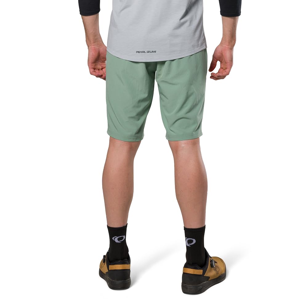 PEARL IZUMI Pantalón corto de ciclismo de montaña para hombre. Forro de gamuza desmontable y dos bolsillos con cremallera. Entrepierna cómoda y duradera de 11.5 pulgadas.