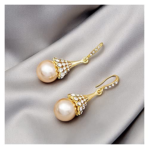 Boucles d'oreilles perle champagne légères pour sublimer un port de tête fatigué