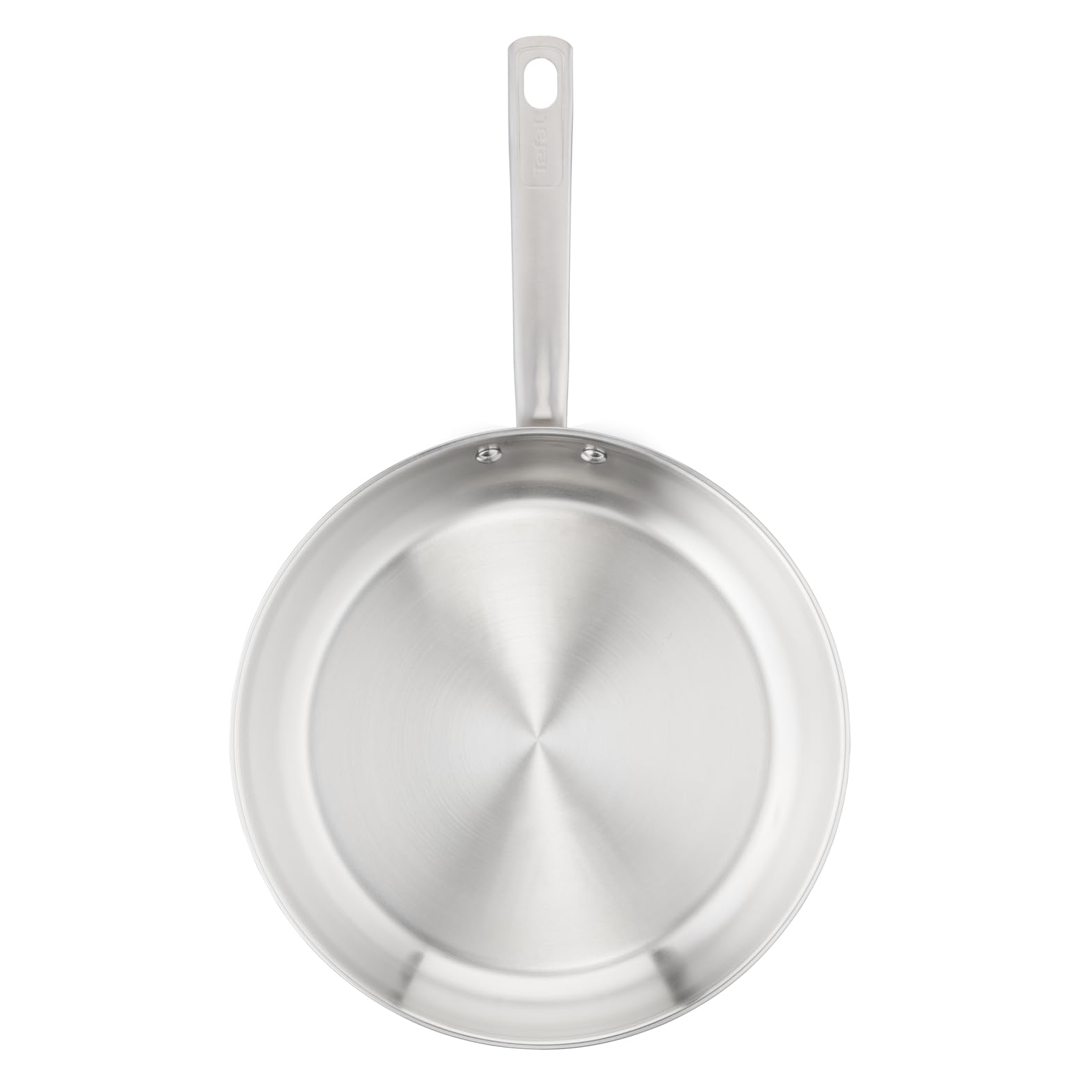 Gros plan sur la surface en acier inoxydable non revêtu d'une poêle Tefal Virtuoso, prête pour une saisie parfaite.