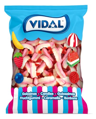 Vidal Golosinas. Colmillos de Vampiro. Golosina con forma de colmillos de vampiro con increíble sabor fresa nata. Color rosa, blanco y rojo. Sin Gluten. Sin Grasa. Bolsa de 250 unidades.