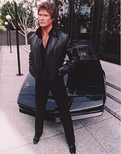 David Hasselhoff standing in Black Leather Jacket with Black Pants