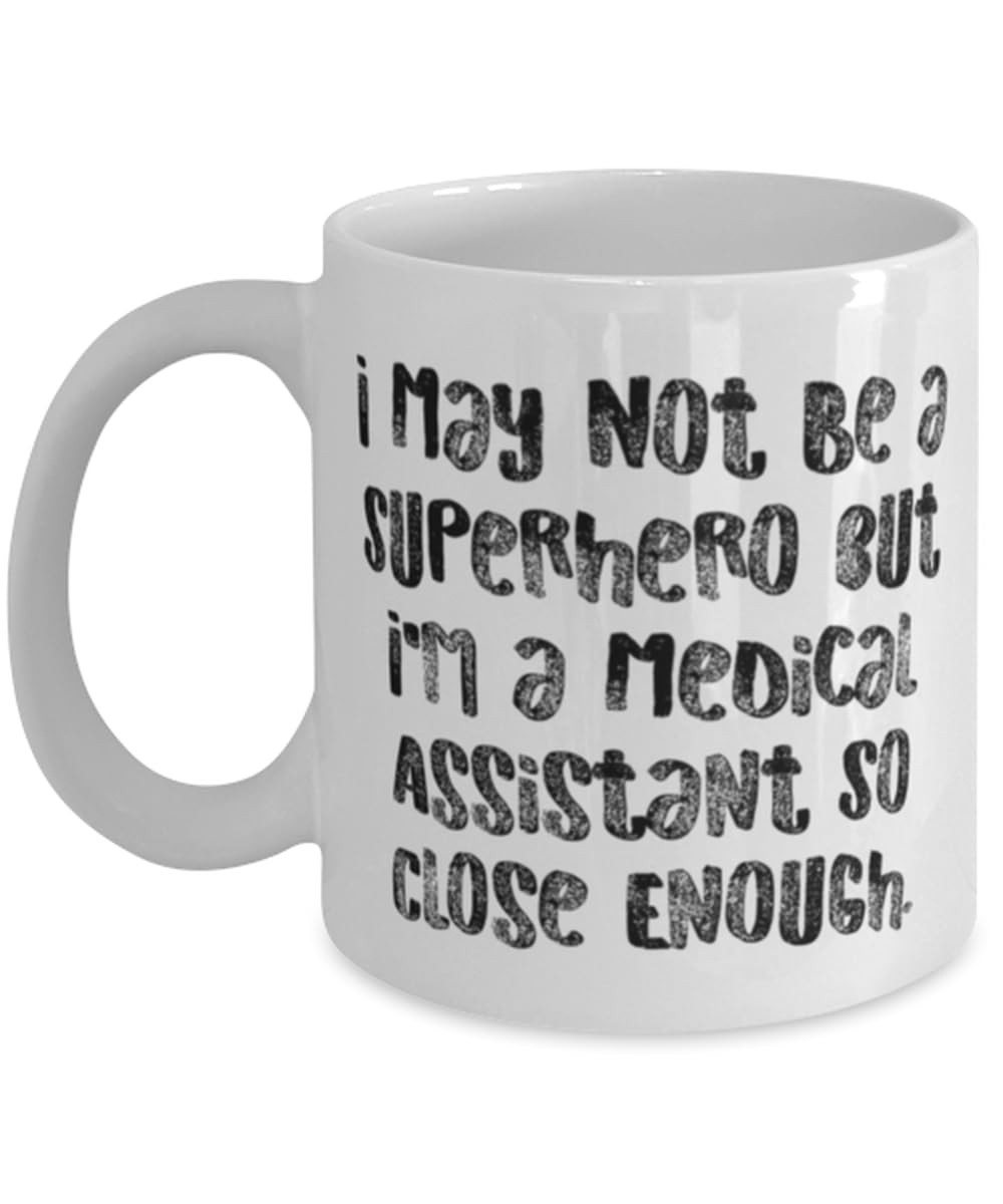 Cool Medical assistant Gifts, I May Not Be a Superhero but I'm, Medical assistant 11oz 15oz Mug From Coworkers, Cup For Friends, Gag gifts for medical assistants, Funny medical assistant shirts, Funny