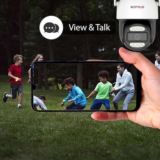 Smartphone displaying live camera feed of children playing, with a 'View & Talk' icon