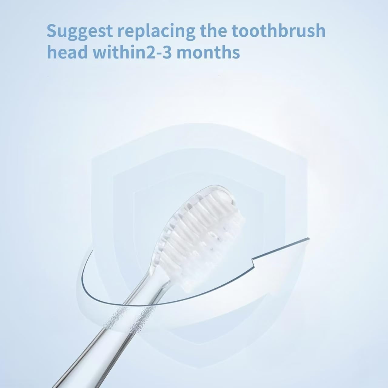 Image showing a toothbrush head with an arrow indicating rotation, and text suggesting replacement within 2-3 months.
