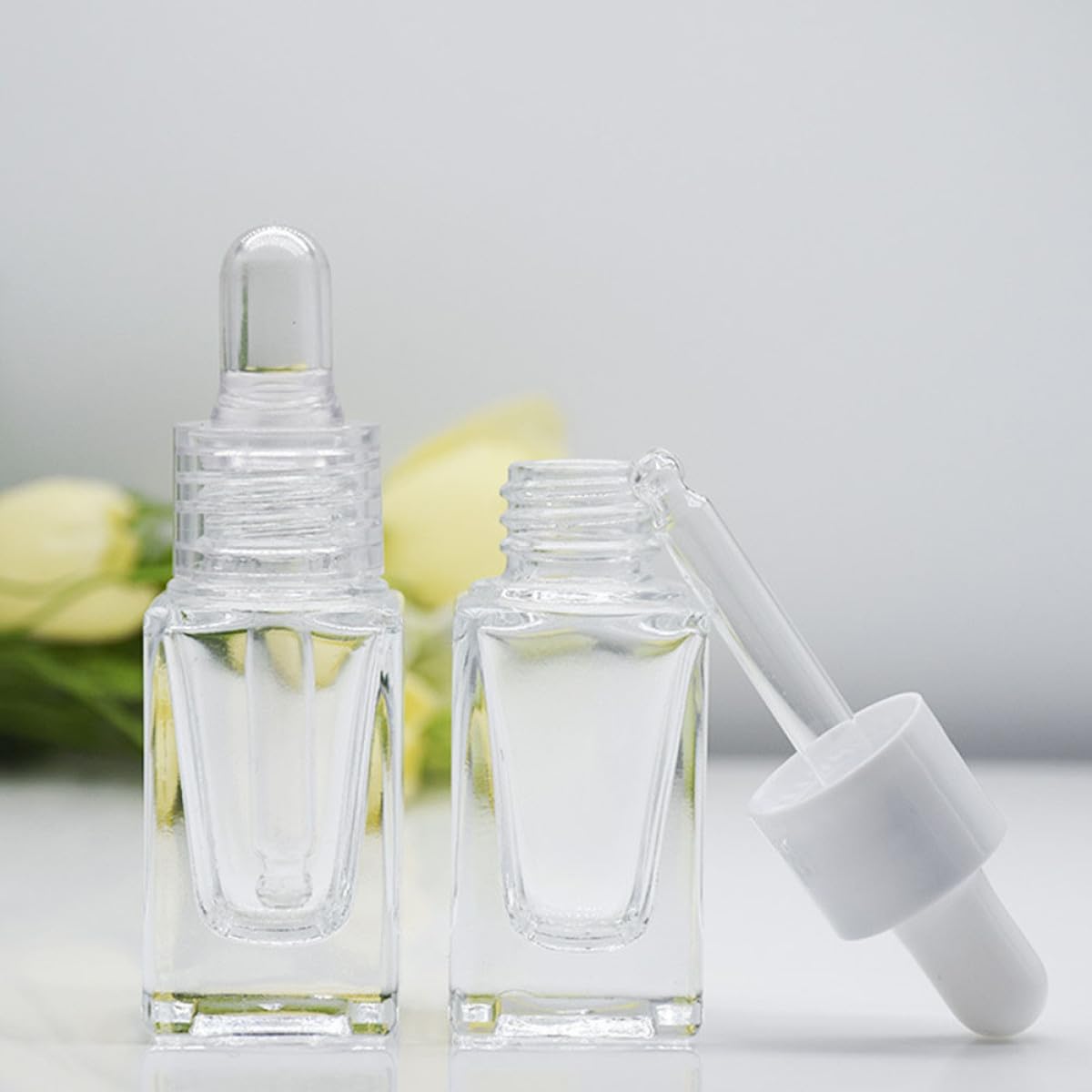 Flaconi Contagocce per Oli Essenziali 15ml in Vetro Trasparente Quadrato, Set da 10 Pezzi Contagocce in Vetro e Anello Plastico Bianco, Ricaricabili e Portatili per