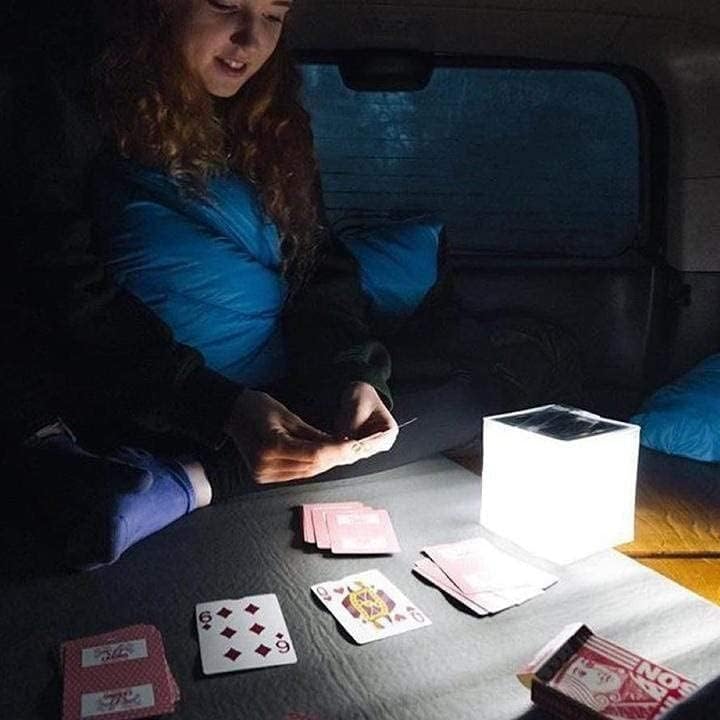 Person using Solight Design Helix Solar Lantern indoors
