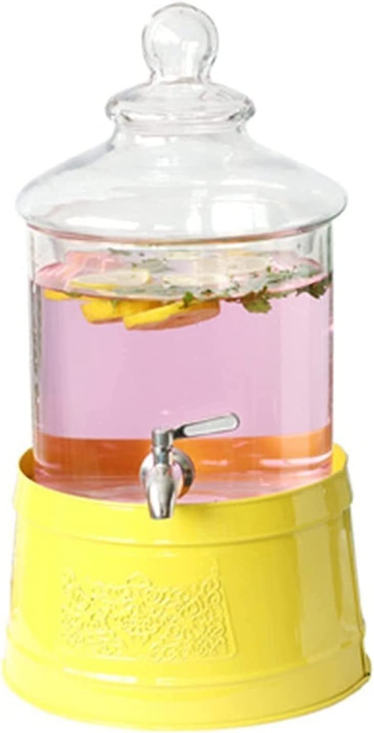 Distributeur de boissons en verre transparent pur et son socle porte-seau design