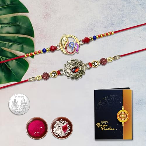 Image of Oblivion Ganesha and Floral Bloom Rakhi Set of 2 for Brother with Silver Colour Pooja Coin, Tilak Set and Greeting Card for Raksha Bandhan Celebration