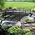 Metal Garden Bridge 8 FT - Durable Decorative Footbridge with Siderails Large Outdoor Bridges, Weight Capacity 770 lbs for Backyard, Creek, Lawn, Stream