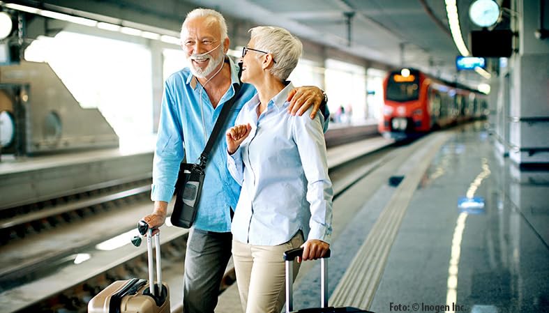 Couple with Inogen Rove 6 at a train station