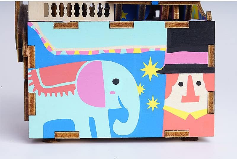 Side view of the music box with elephant and clown artwork