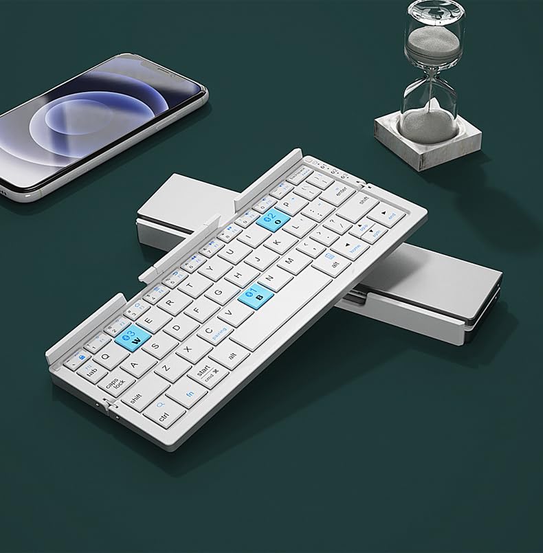 Hands typing on the JOMAA Mini Foldable Bluetooth Keyboard, with a smartphone nearby.