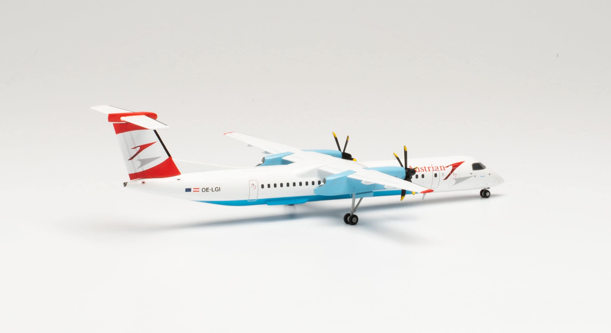 herpa 571968 Austrian Airlines Bombardier Q400 - Modellino aeroplano in miniatura, da collezione, multicolore