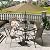 Amopatio Outdoor Dining Set of 5, Patio Table and Chairs Set, Textured Glass Tabletop, 4 Stackable Patio Chairs, Patio Furniture, Balcony, Porch, Lawn- Brown