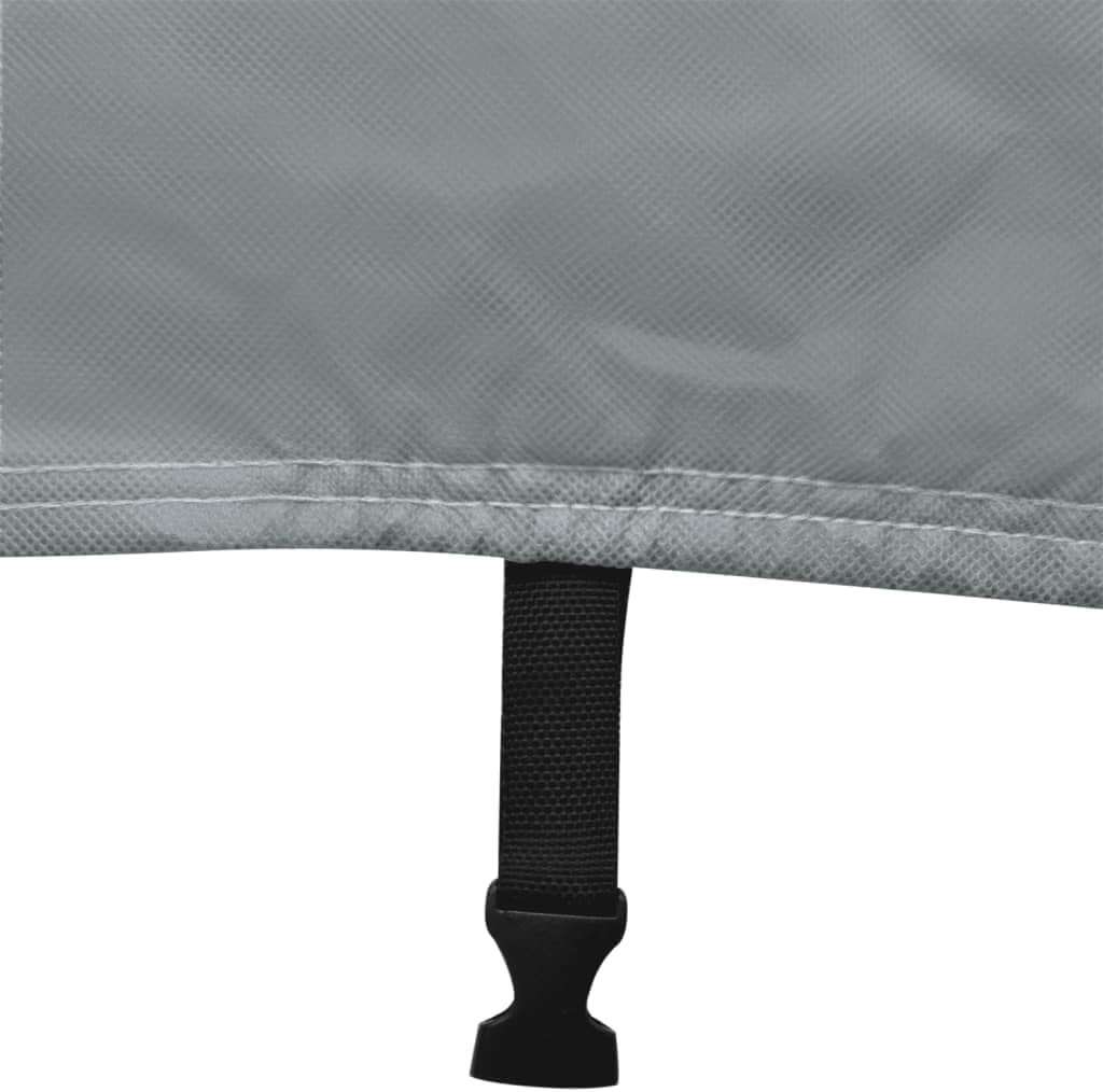 Close-up of a black tie-down strap with a buckle, used to secure the caravan cover.