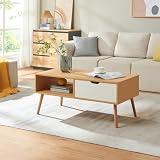 Rangements pratiques : un compartiment inférieur et un tiroir permettent de garder les accessoires et petits objets à portée de main, tout en conservant un salon ordonné.