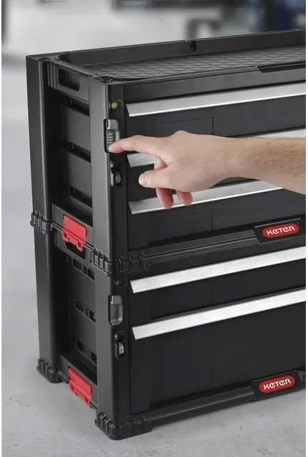 A hand demonstrating how to engage the side latch on a Keter module for stacking.