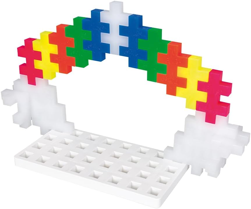 A dog figure built with white and black Plus-Plus pieces on a white pegboard