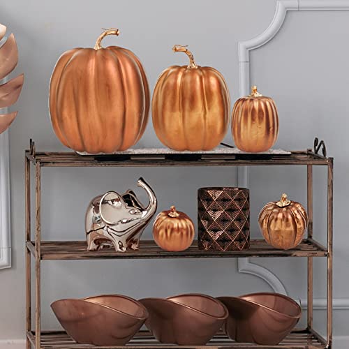 Image of Winlyn 7 Pcs Assorted Sizes Artificial Metallic Bronze Pumpkins Rustic Decorative Fall Foam Pumpkins for Gifts Thanksgiving Halloween Harvest Fall Wedding Table Centerpiece Mantel Shelf Decor