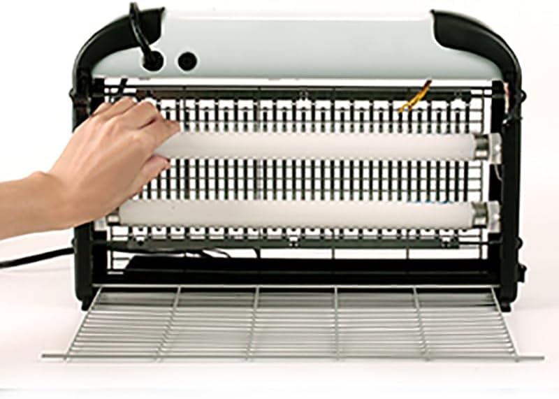 Hand removing an old bulb from a bug zapper