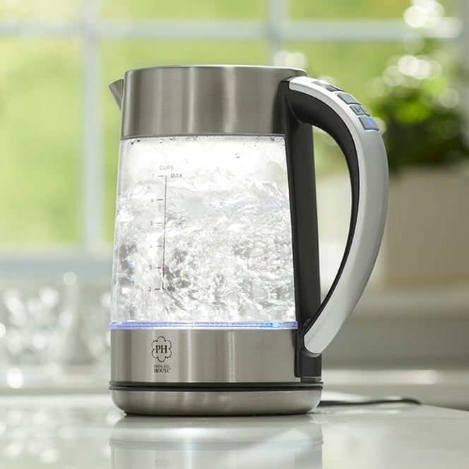 Princess House electric kettle boiling water with blue LED illumination.