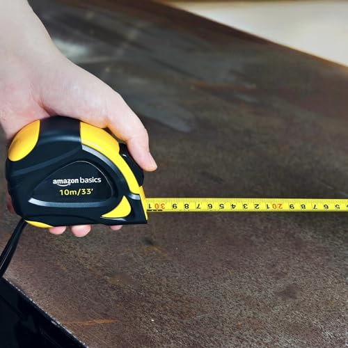 Image of Amazon Basics Self-Locking Tape Measure with Belt Clip, 33 feet (10 m), Inch /Metric Scale, MID Accuracy, Black, Yellow