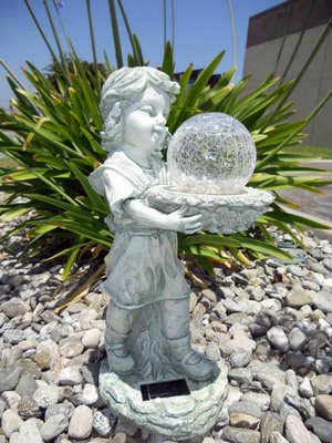 Girl holding Color Changing Crackle Ball Solar Light
