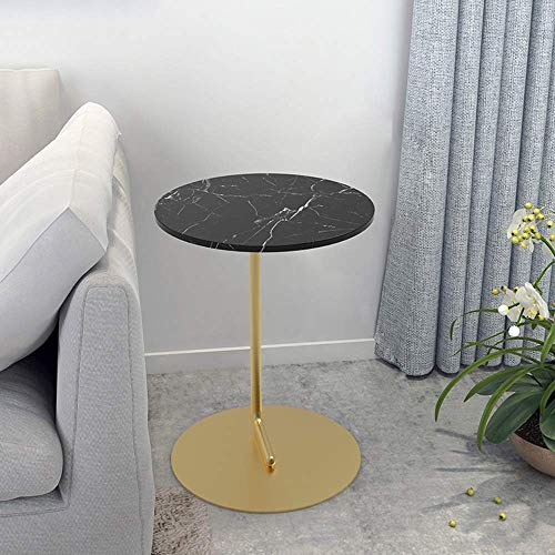 Table basse ronde en marbre stable et compacte pour optimiser les petits salons