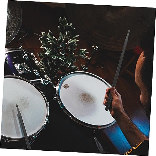 Par de baquetas negras con grip para batería y percusión miniatura 2