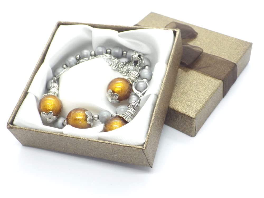 Conjunto de bisutería pendientes, collar y pulsera en acero inoxidable, hematites y cuentas de cristal de Murano color oro