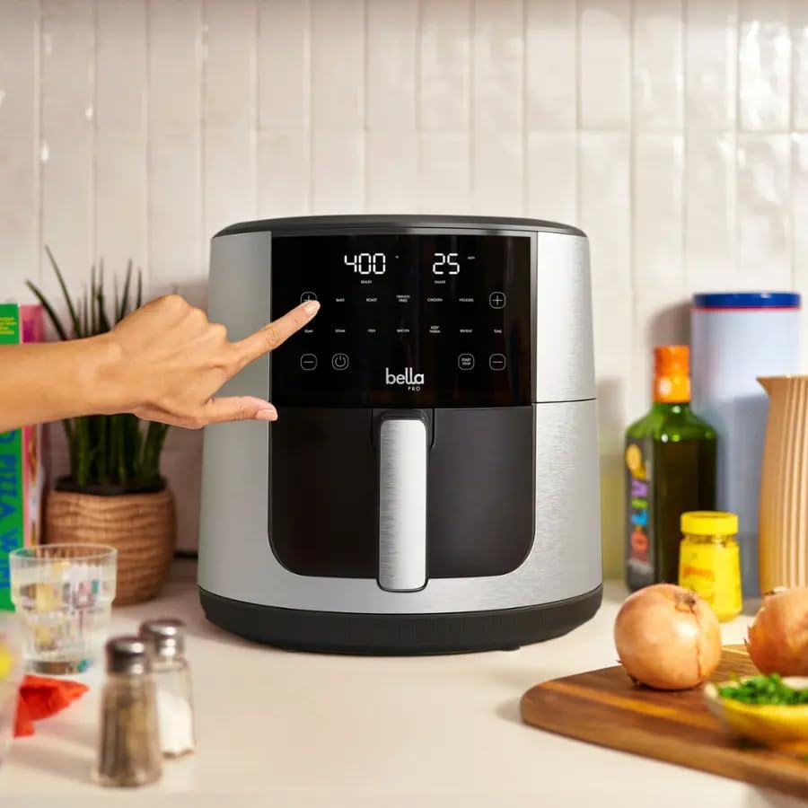 Hand touching the smart touchscreen control panel of the Bella Pro Series 8-Qt Air Fryer.