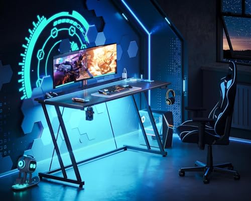 Image of MOTPK 55 Inch Gaming Desk with LED Lights & Power Outlet, Computer Desk for Small Space, Cheap Gaming Table with Carbon Fiber Texture, Kids Desk Gift for Boys Men, Black