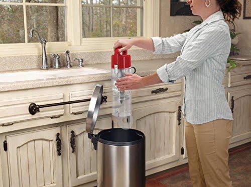 Woman emptying the dirt cup of the Dirt Devil Quick Lite Plus vacuum