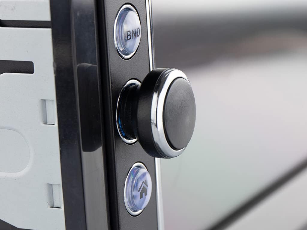 Close-up of the control buttons and rotary knob on the left side of the car radio's front panel.
