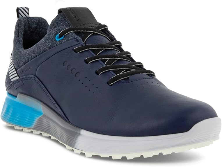The ECCO Men's S-Three Gore-tex Golf Shoe is a premium golf shoe designed for optimal performance on the course. It is constructed with a durable leather upper and features Gore-tex waterproof technology to keep your feet dry in all weather conditions. The shoe also has a removable OrthoLite insole for added comfort and support during those long rounds of golf.
With a sleek and modern design, the ECCO Men's S-Three Gore-tex Golf Shoe offers both style and functionality. The outsole is made with ECCO's Fluidform technology, providing excellent traction and stability for your swing. The shoe also boasts ECCO's renowned design and craftsmanship, ensuring a high-quality product that will last for many rounds on the course. Whether you're a casual golfer or a seasoned pro, the ECCO Men's S-Three Gore-tex Golf Shoe is a top choice for comfort, performance, and style. Description by ChatGPT.