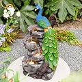 Glitzhome Outdoor Water Fountain,20.5" H Polyresin Outdoor Fountain with Lights, 4-Tierd Peacock W/Stacked Stone Decorative Waterfall Feature Garden Fountain with Pump for Garden, Patio, Porch Decor