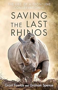 Paperback Saving the Last Rhinos: One Man's Fight to Save Africa's Endangered Animals Book