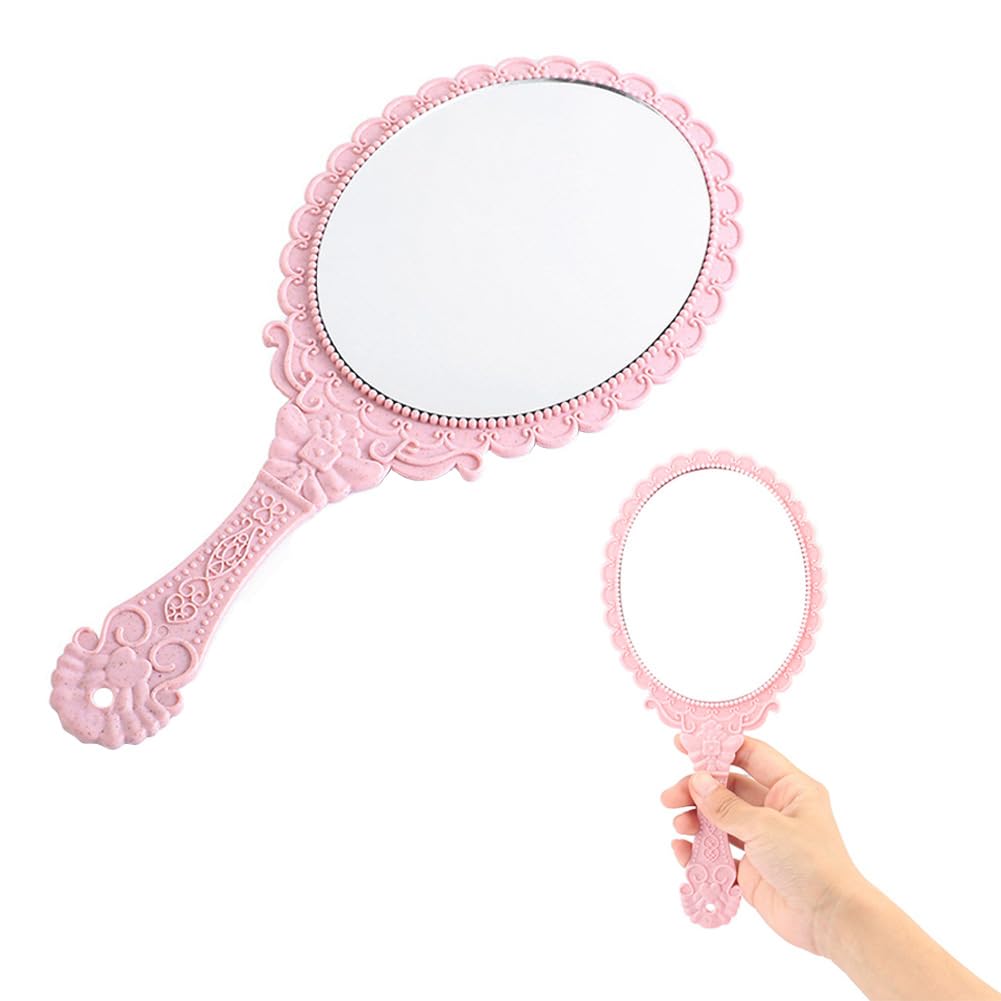 Miroir de maquillage vintage ovale rose aux finitions sculptées en relief de style baroque