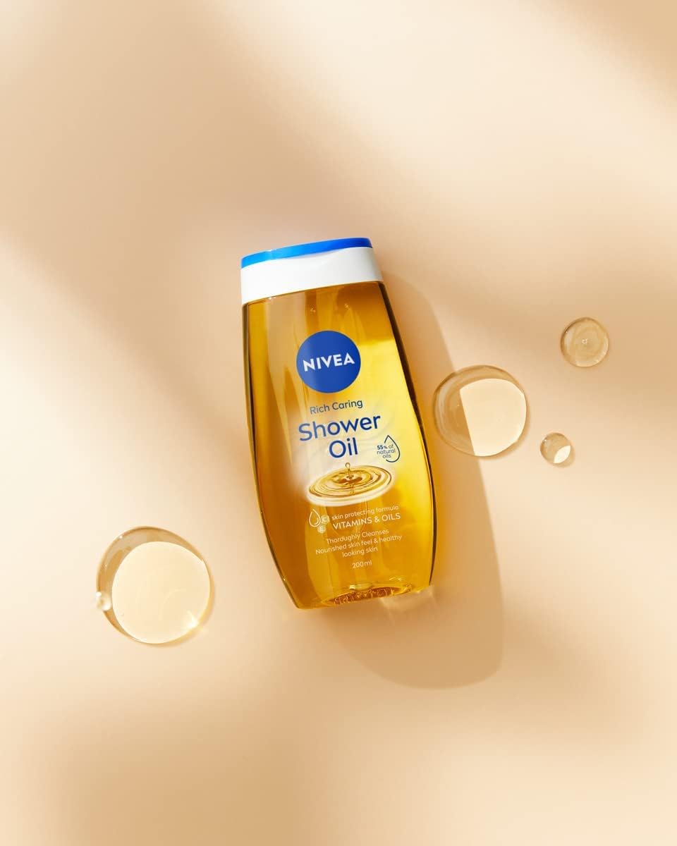 NIVEA Doccia Olio Rich Care Detergente Corpo Nutriente Formula Biodegradabile ad Azione Idratante e Protettiva Docciaschiuma con Oli Naturali e Vitamine C ed E per Pelli Secche - 4 Flaconi da 200ml