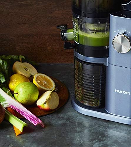 Hurom H-AI-LBB20 H-AI Slow Juicer extracting green juice with fruits
