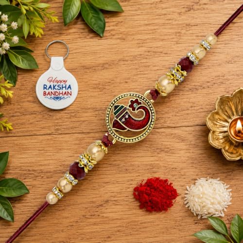 Image of Riddhika Ventures Religious Gold Plated Meenakari Sacred Ganesha Rakhi with Roli Chawal, Greeting Card & Happy Raksha Bandhan Keychain