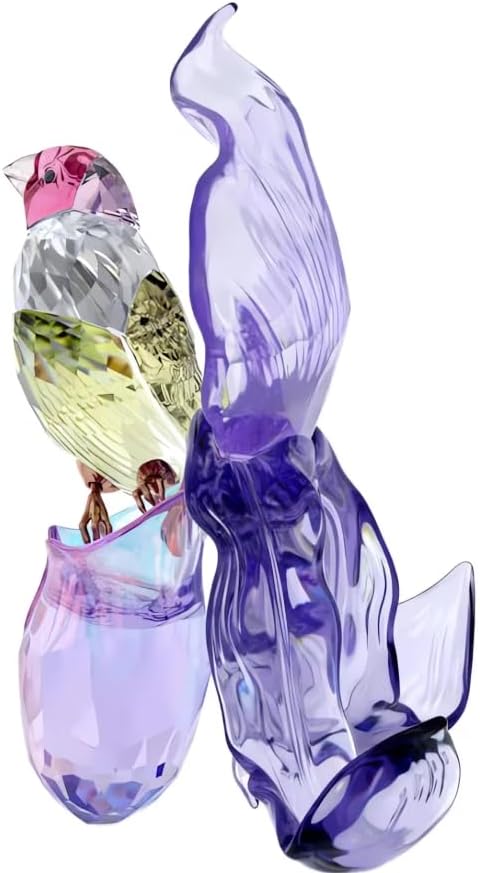 Close-up view of a vibrant crystal Gouldian finch perched on a purple crystal orchid.