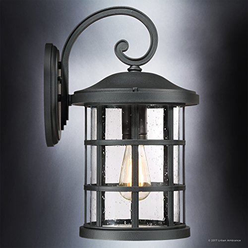Image of Luxury Craftsman Outdoor Wall Light, Medium Size: 17.75 inch H x 10 inch W, with Tudor Style Elements, Wrought Iron Design, Natural Black Finish and Seeded Glass, UQL1044