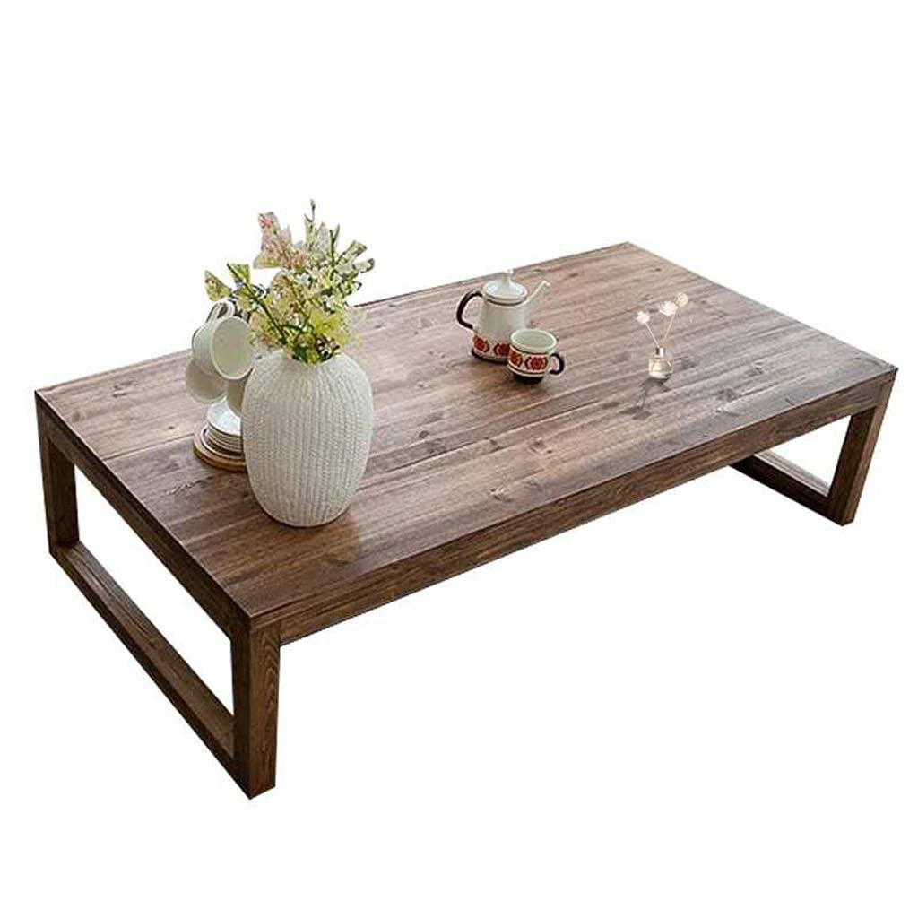 Table basse japonaise en bois pour aménager un coin thé relaxant près de la baie vitrée