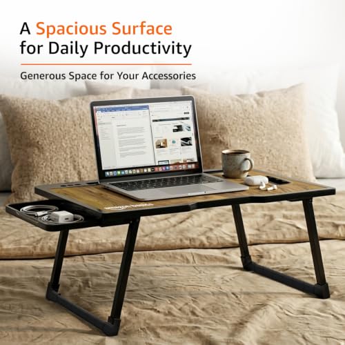 Image of Amazon Basics Engineered Wood Foldable Laptop Table with Cup and Pen Holder, Tablet and Mobile Phone Groove | Mini Drawer, Use for Writing, Bed, Breakfast (60L x 40W x 25H cm, Brown)