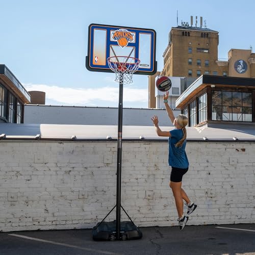 Image of Lifetime NBA New York Knicks Portable Basketball Hoop, Adjustable Height 7.5-10 Ft, 44 Inch Shatterproof Fusion Backboard, Base with Wheels